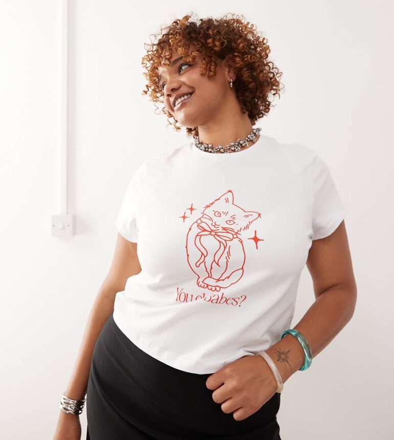 Noisy May Curve baby tee with cat graphic in white
