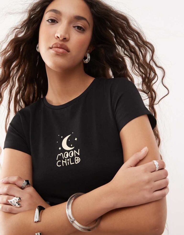 Noisy May baby tee with moon child graphic in black