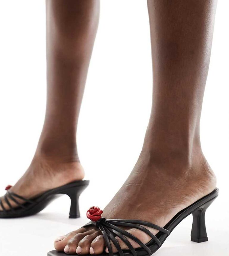 Public Desire Wide Fit Vertigo mid heeled mule with rosette in black-Pink