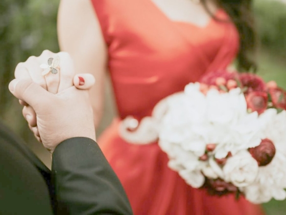 A close-up of a couple's hands sharing a moment.