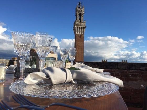 Beautiful table setting overlooking a historic tower.