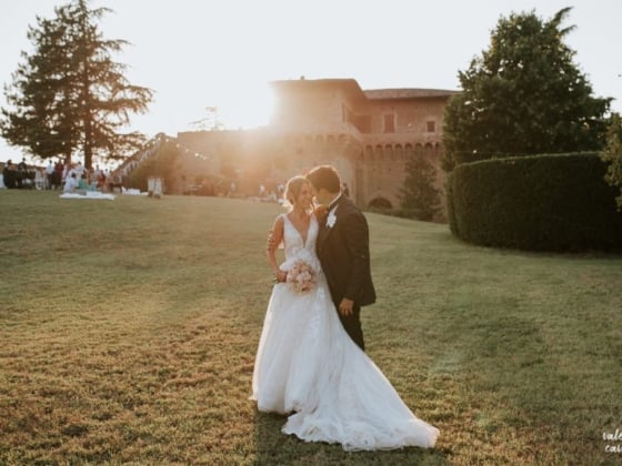 Bride and groom at sunset in a beautiful outdoor setting.