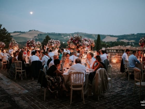 Guests enjoying a beautiful evening at a festive outdoor gathering.