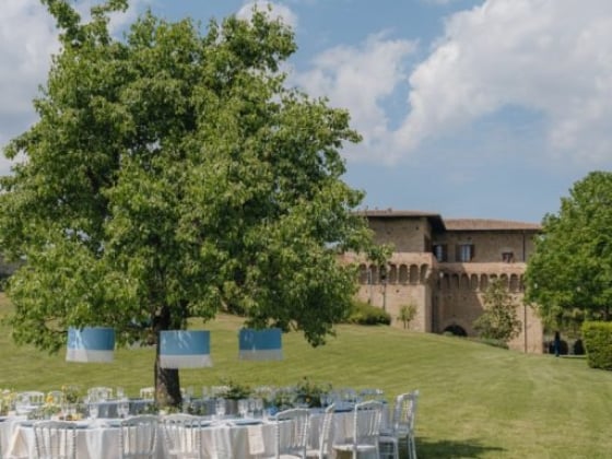 A beautiful outdoor dining arrangement with tables and chairs.