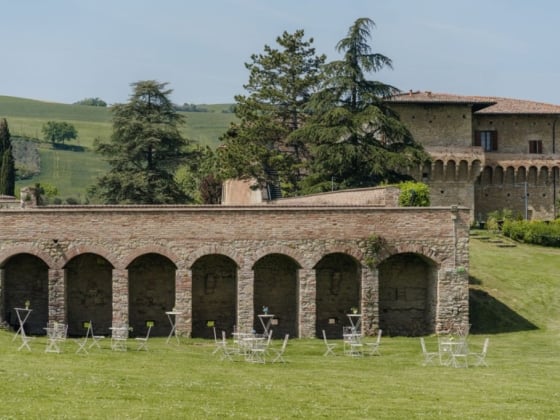 A beautiful estate featuring arches and lush greenery.