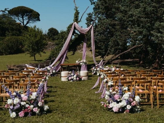 Beautifully arranged ceremony area in a garden setting.