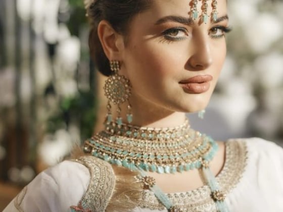 A beautifully styled woman showcasing traditional fashion and accessories.