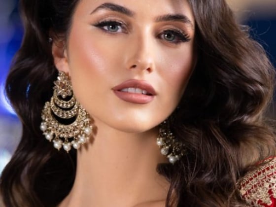 Elegant woman showcasing rich cultural attire and accessories.