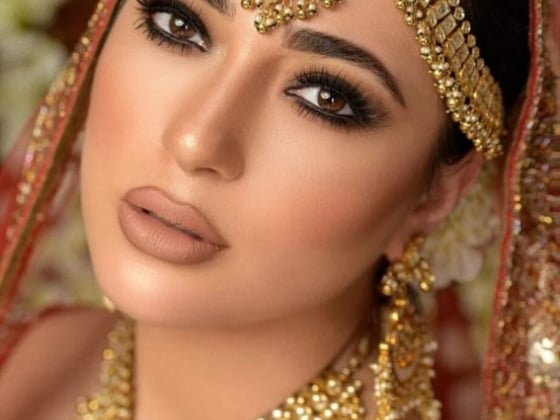 Elegant close-up of a woman in traditional bridal attire.