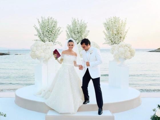 A happy couple celebrating their wedding by the sea.