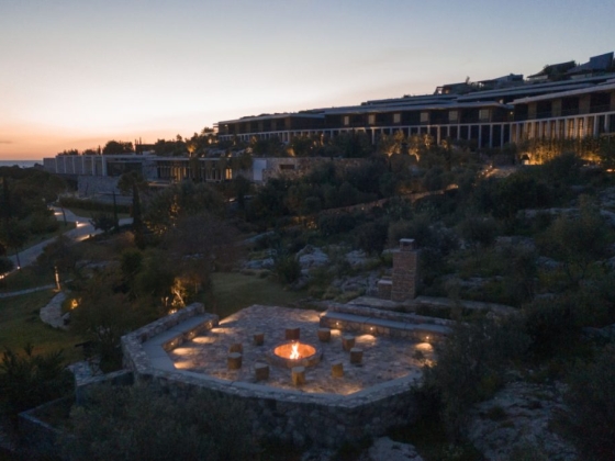 A tranquil resort setting featuring a fire pit.