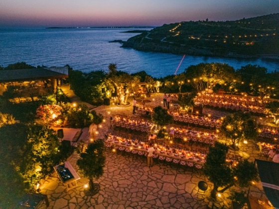 Beautiful garden dining area illuminated at dusk.