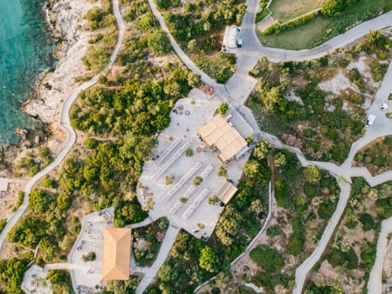 Aerial shot of a landscaped area by the sea.