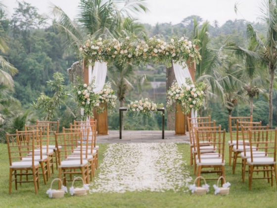 Beautifully arranged wedding altar in a lush landscape.