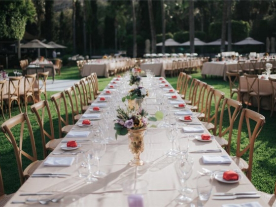 Stylish banquet tables set for an outdoor event.