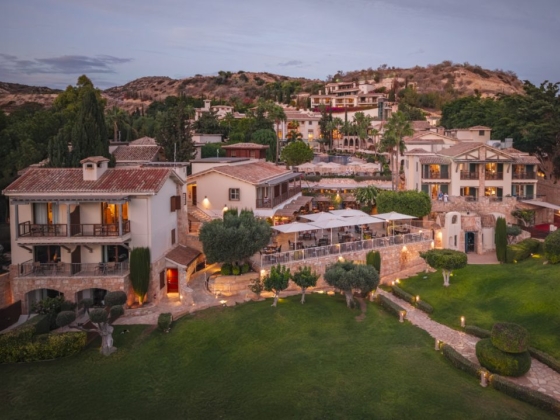 Aerial view of a serene resort in a scenic setting.