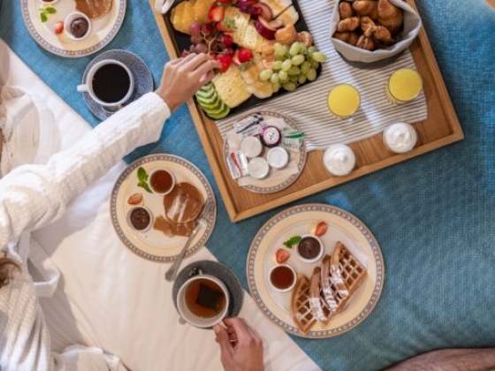 Enjoying a delightful breakfast spread in cozy robes.