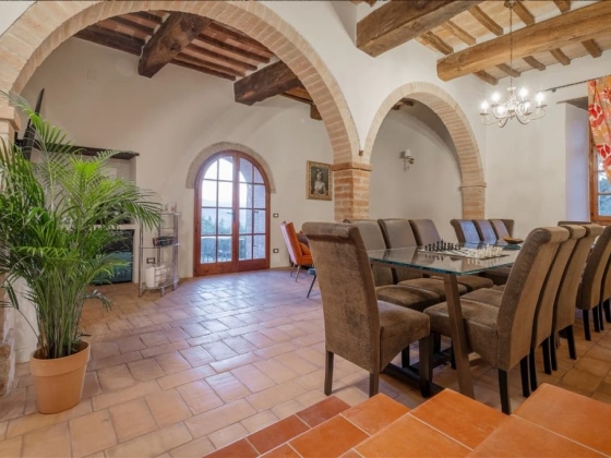 Spacious dining area featuring a chess set and large windows.