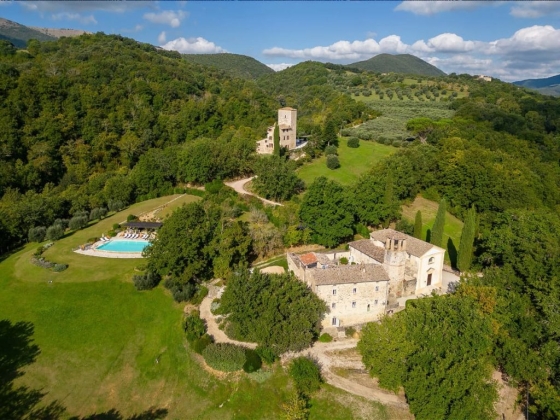 Scenic landscape featuring a villa and swimming pool