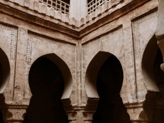A historical space featuring vaulted arches and traditional furnishings.