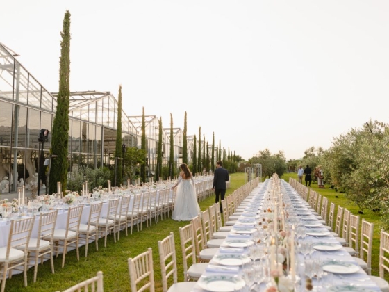 Elegant long table amidst greenery for a wedding
