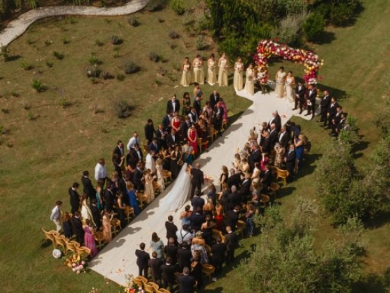 Guests gathered for a wedding in a garden setting.