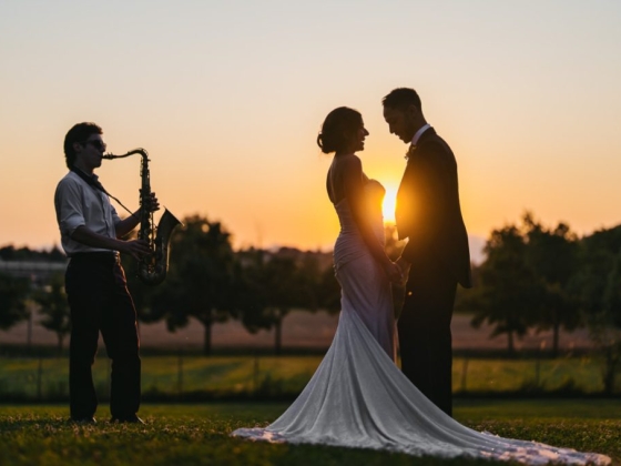 A romantic moment with music at sunset.
