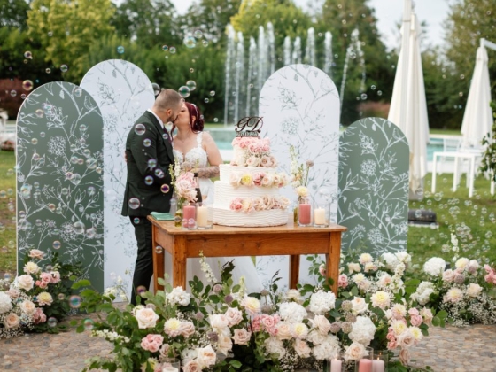A romantic moment with a wedding cake and decorations.