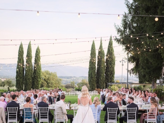 Guests enjoying a scenic dinner at a festive wedding reception