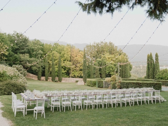 Elegant table arranged in a serene outdoor setting.
