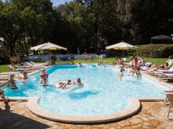 People enjoying leisure time at a poolside