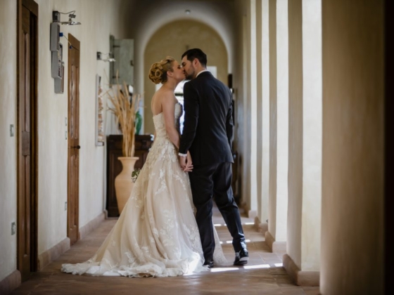 A romantic moment between a couple in wedding attire