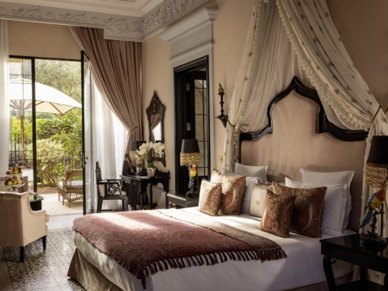 Luxurious room featuring intricate furnishings and natural light.