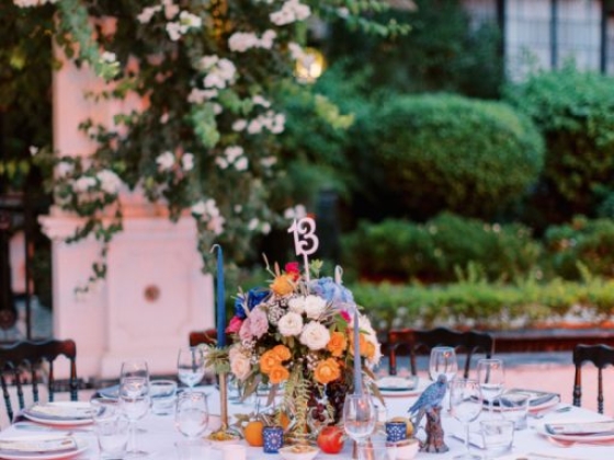 Beautifully arranged table with flowers and settings for an event.