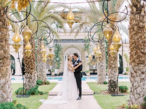 Romantic wedding moment in a lush garden setting.
