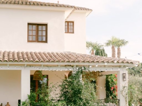 A stylish home with a welcoming entrance and lush plants.