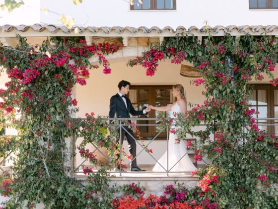 Bride and groom enjoying a romantic moment outdoors.