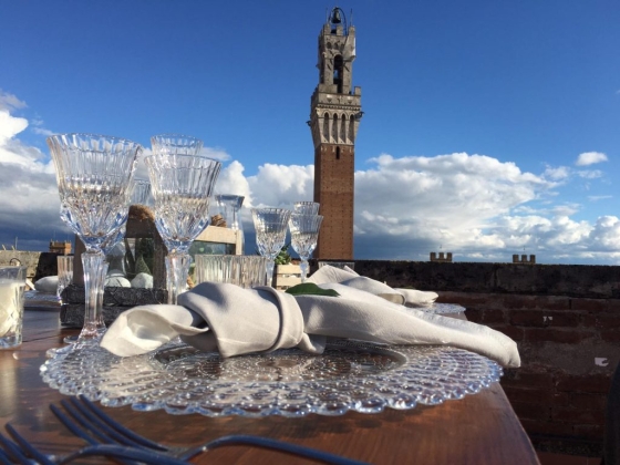 Beautiful table setting overlooking a historic tower.