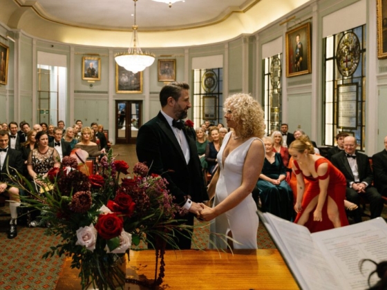 A couple stands together in a heartfelt wedding ceremony.