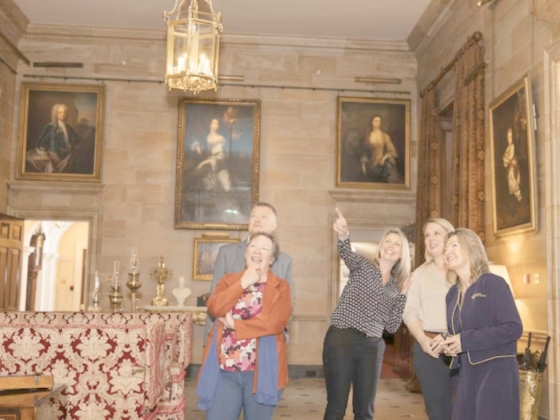 Visitors engaging with artwork in a museum setting