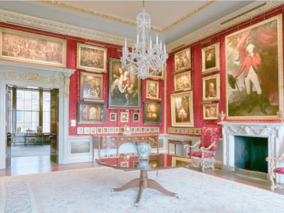 Interior of a lavish art-filled room with ornate decor.