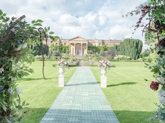 Beautiful view of a landscaped garden and mansion.