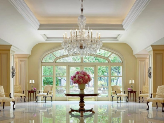 Luxurious lobby featuring soft seating and large windows.