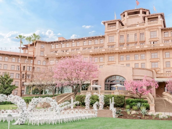A beautiful venue decorated for a wedding with pink flowers.
