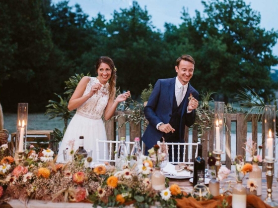 bride and groom dancing close to their table