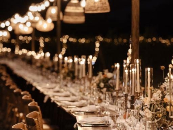 long wooden tables with lights and lamps