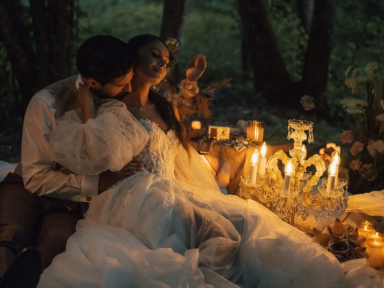 A romantic scene featuring a couple in an outdoor setting.