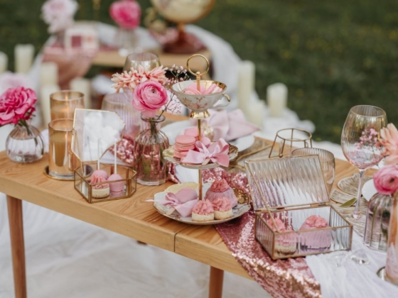 Charming setup featuring pink treats and flowers.
