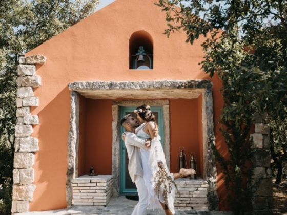 A joyful moment captured by a charming, rustic home.
