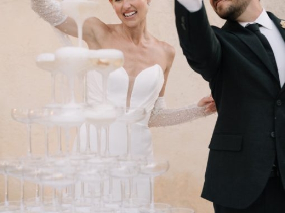 Celebrating with a champagne tower at a wedding